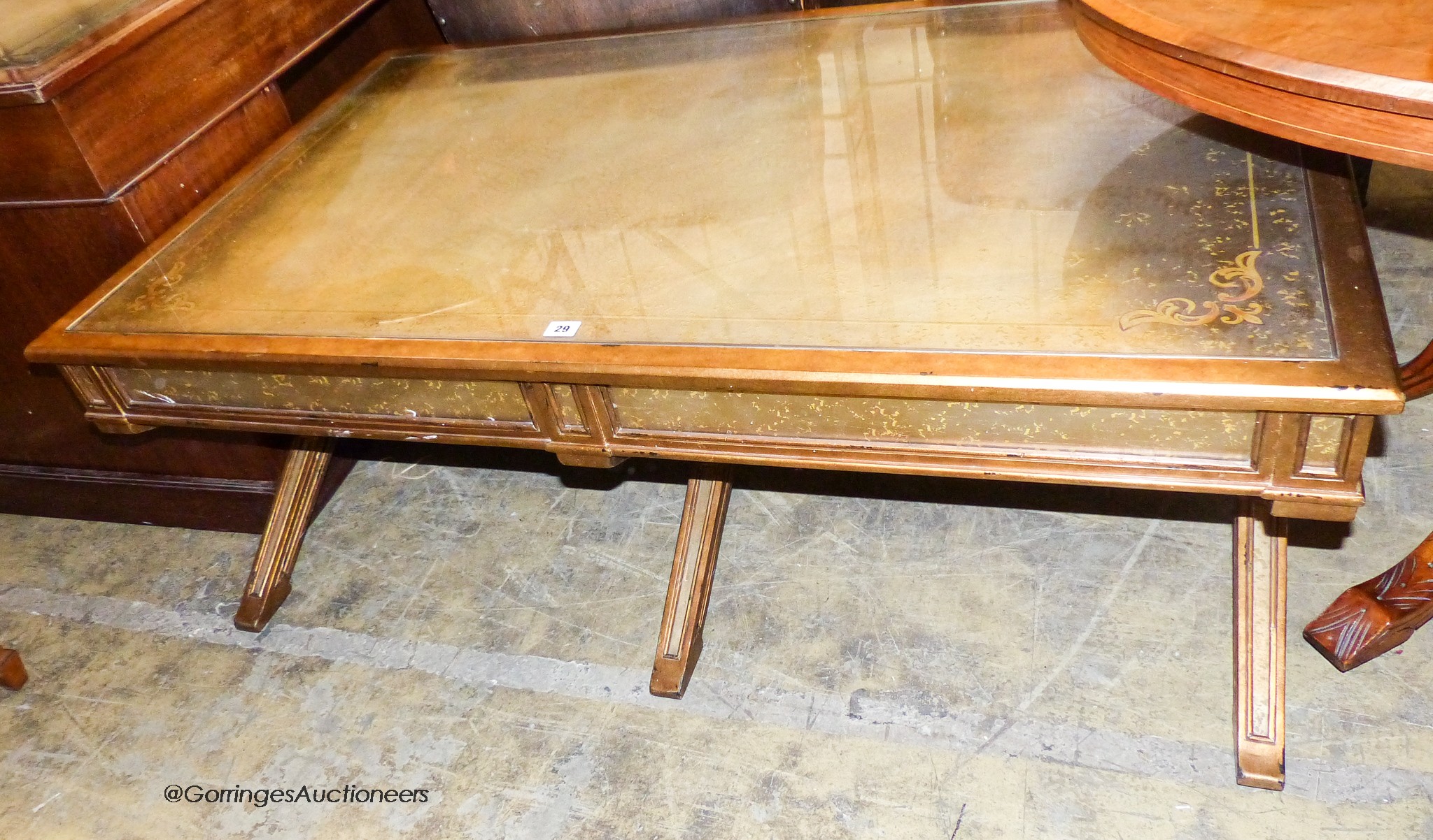 An Italian style gilt and glass 'X' frame coffee table fitted end drawers, length 132cm, depth 80cm, height 51cm